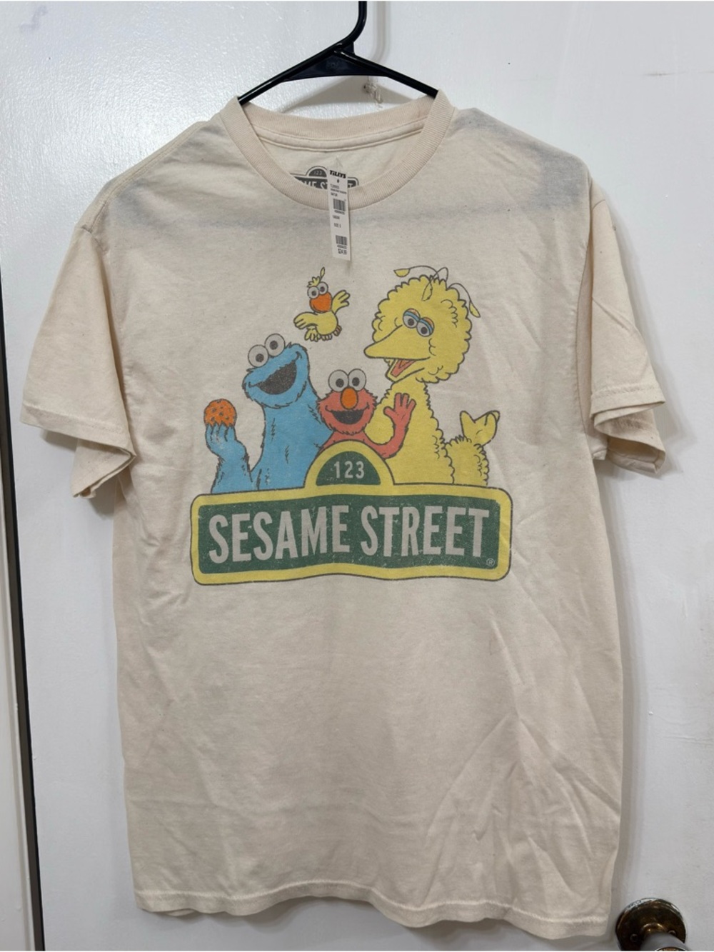 Tilly's Cream Sesame Street Graphic Tee with Characters